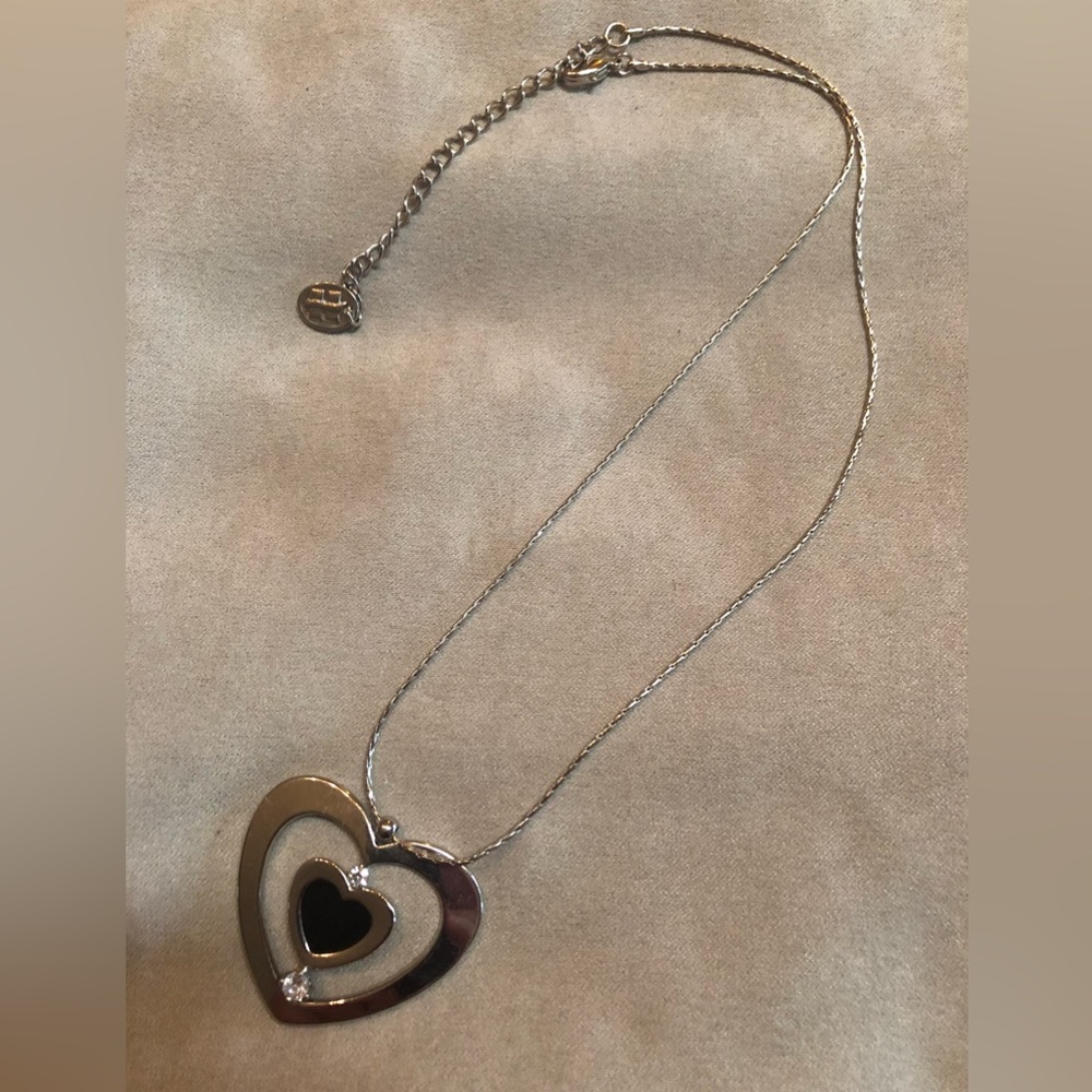 Silver tone heart necklace.